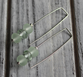 Long earrings.  Handmade glass beads made from a Green Depression Glass Platter