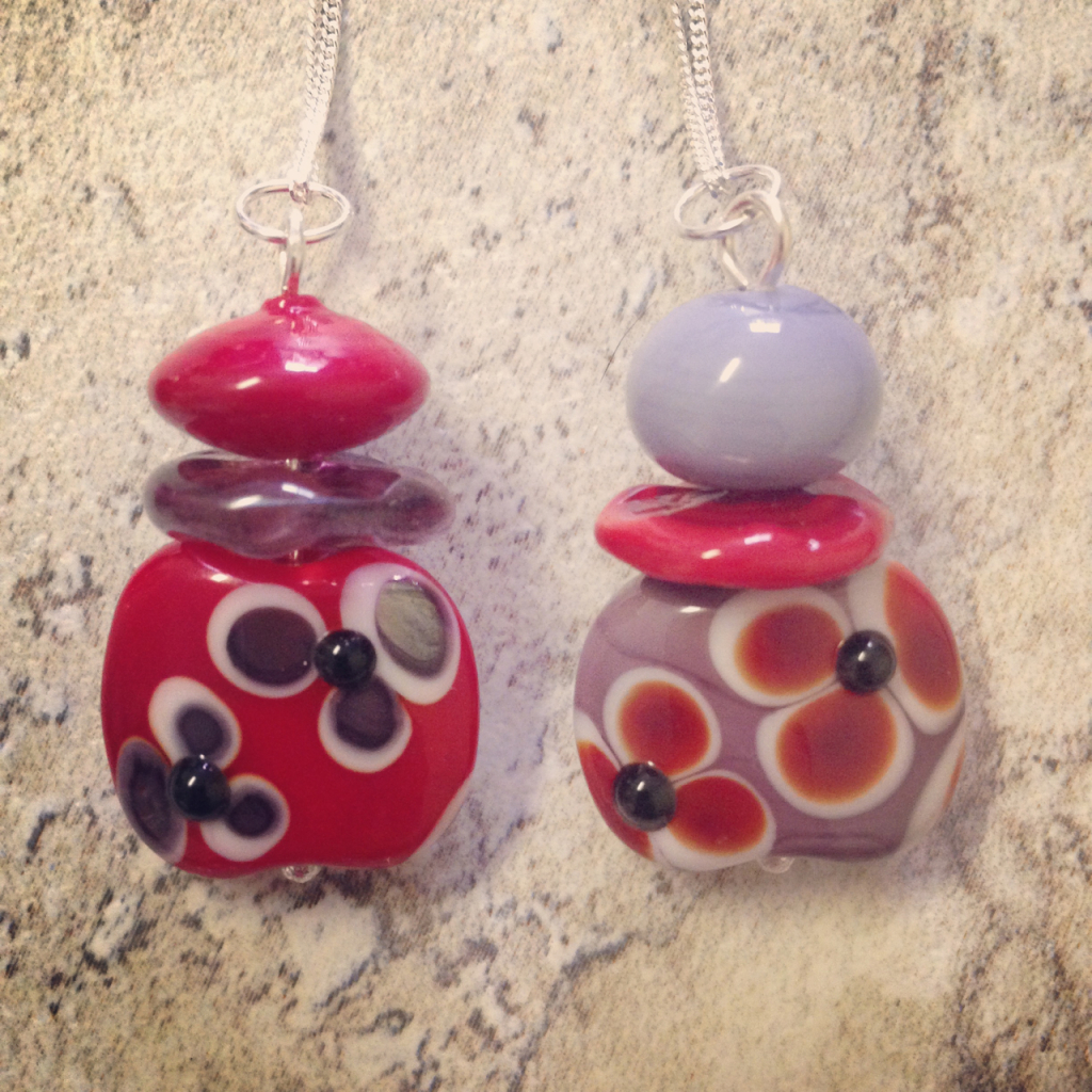 Beautiful flower pendants with handmade glass beads by Julie Frahm