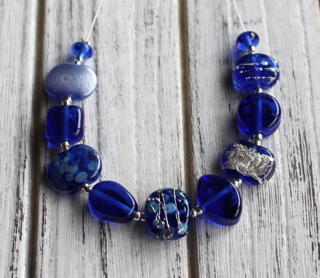 Handmade glass beads from a Skyy Vodka bottle!