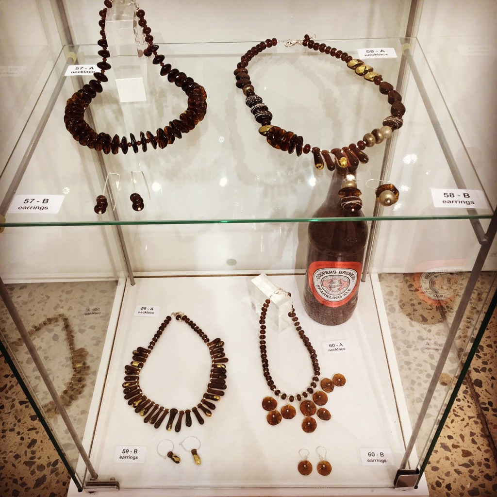 Display of jewellery made from a Coopers Ale bottle 