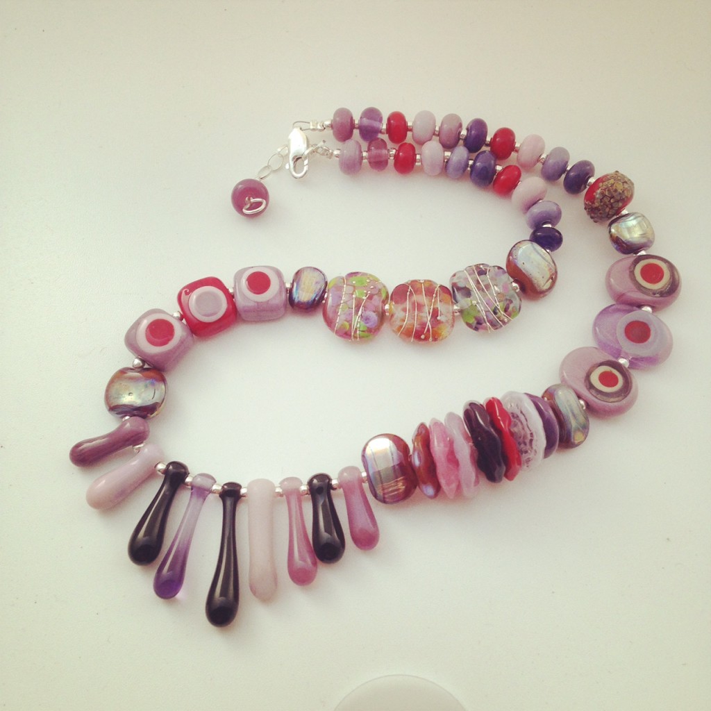 Beautiful selection of purple handmade glass beads by Julie Frahm