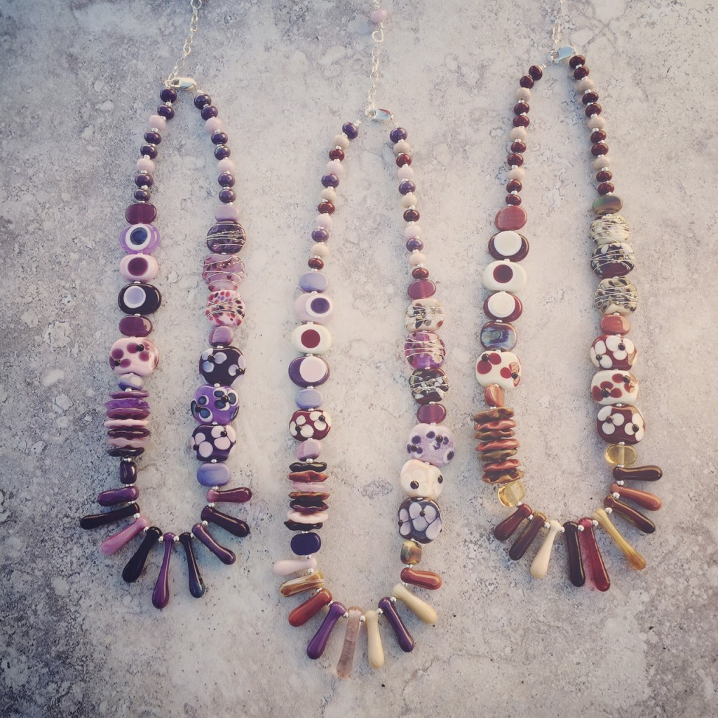 Love these purple and brown necklaces by Julie Frahm.  Handmade glass beads.