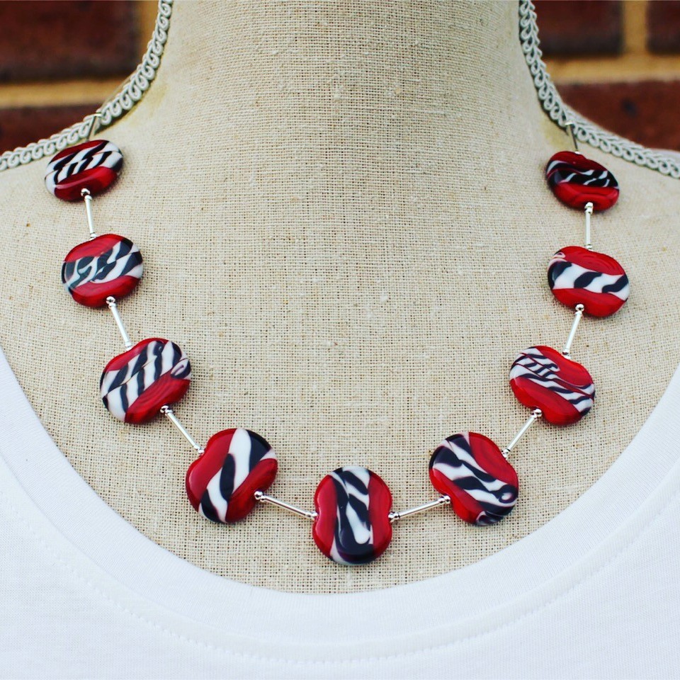 Stunning necklace, perfect with a white t-shirt.  Red black and white beads by Julie Frahm