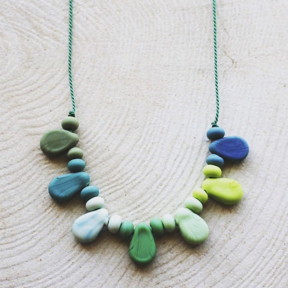 Etched green glass beads on silk necklace