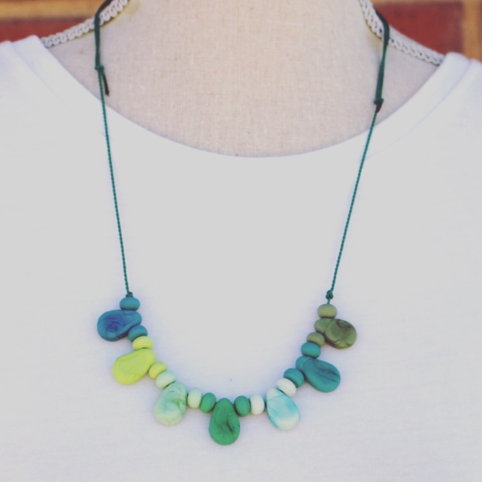 Etched green glass bead necklace on silk cord