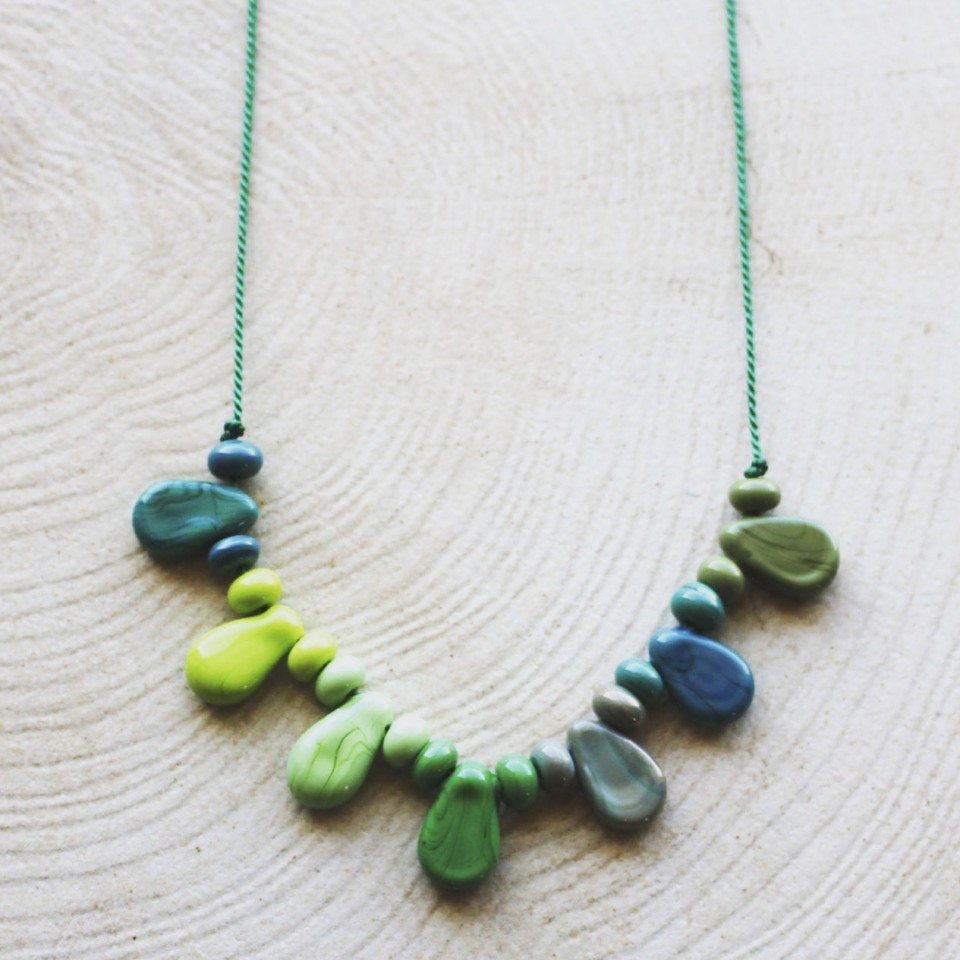 Shiny green glass beads on silk cord necklace