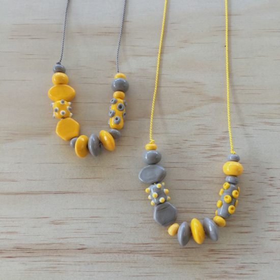 Grey and Yellow glass bead necklaces on silk cord