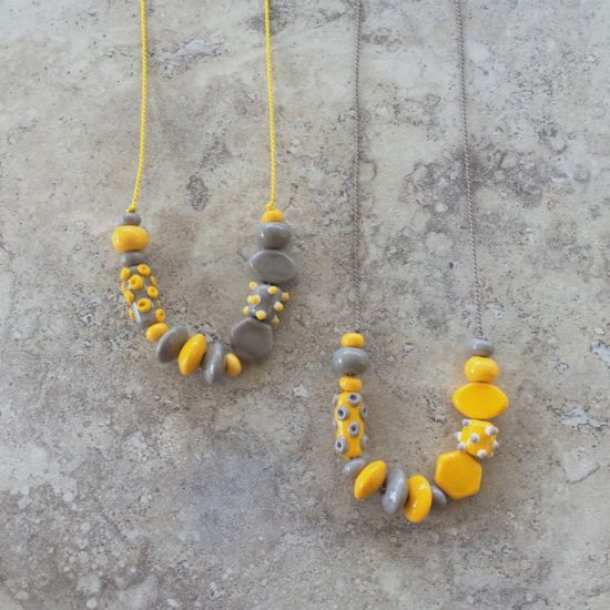 Grey and Yellow glass bead necklaces on silk cord