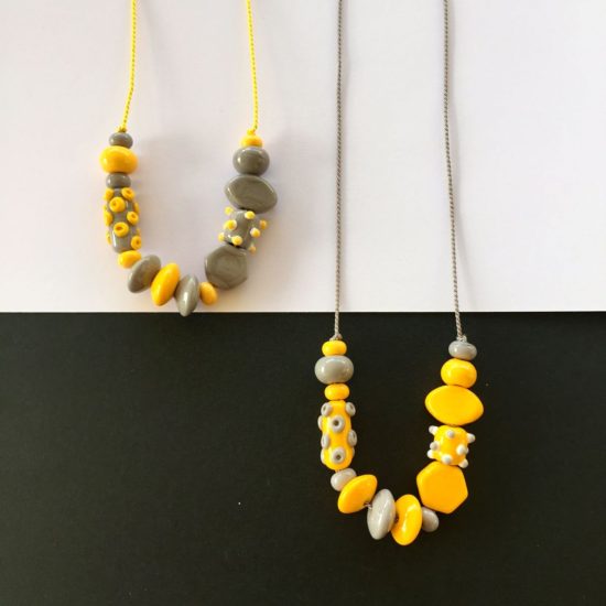 Grey and Yellow glass bead necklaces on silk cord