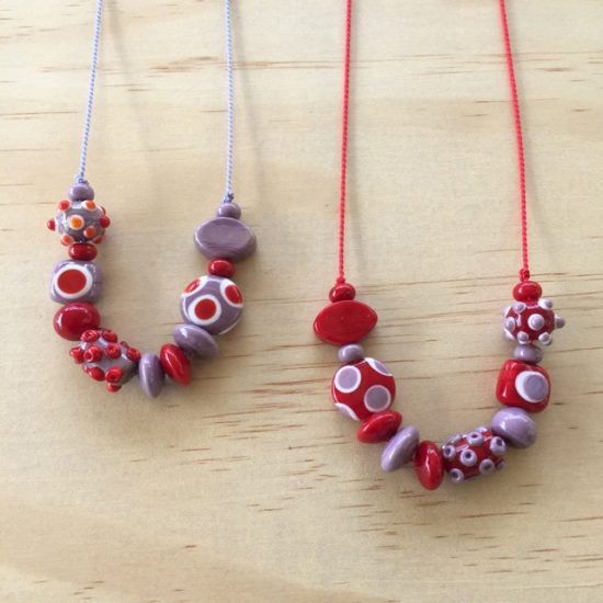 Red and purple handmade glass bead necklaces by Julie Frahm