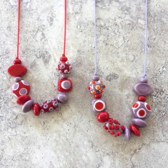 Red and purple handmade glass bead necklaces by Julie Frahm