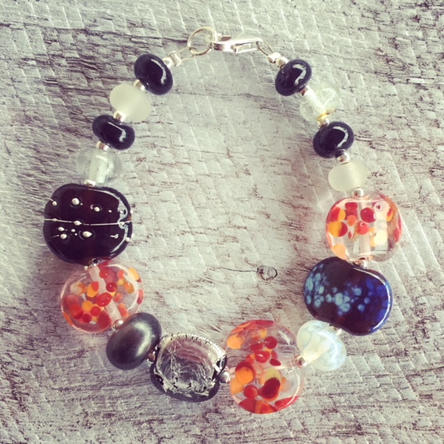 Recycled glass bead bracelet | beads made from gin and tonic water bottles in classic red/black/white colour combination 