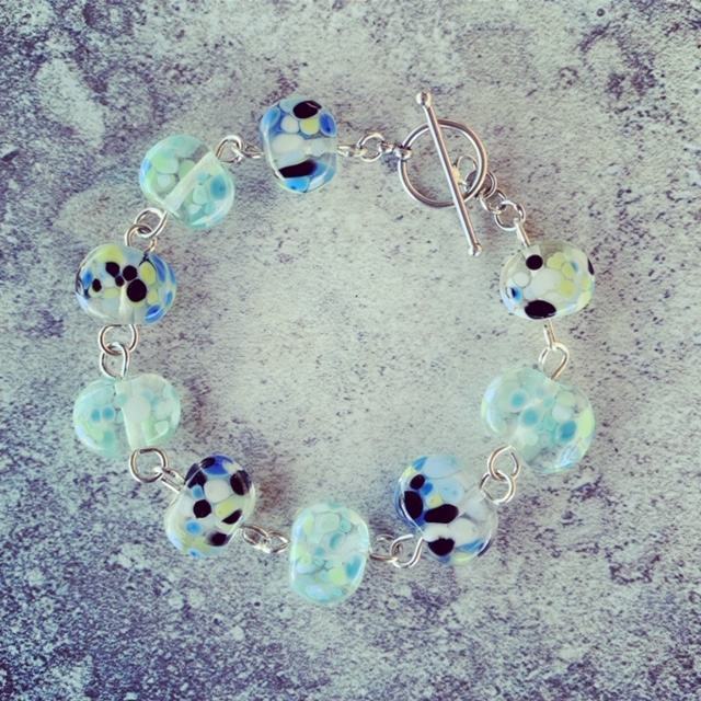 Recycled glass bracelet | beads made from a wine bottle and decorated with smashed up glass 