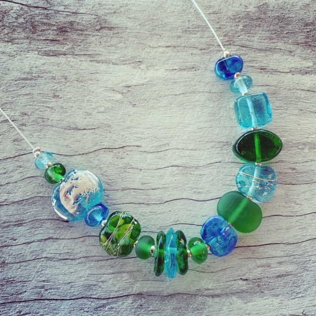 Gin and tonic necklace featuring beads made from Bombay Sapphire and Tanqueray Gin bottles