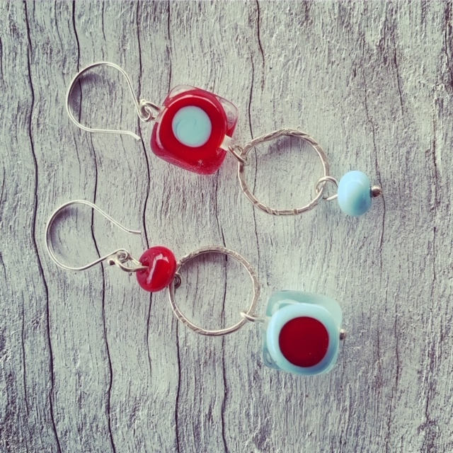New red and blue mismatched earrings