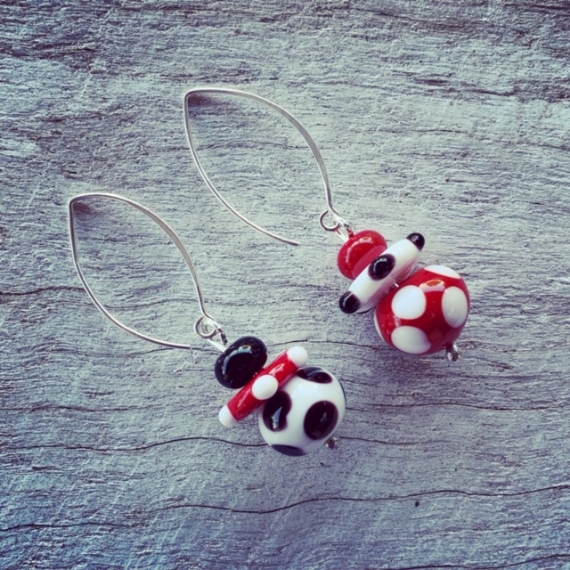 Red, black, white mismatched earrings