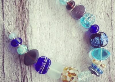 Recycled glass necklace | blue and brown beads made from various recycled glass objects