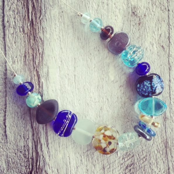 Recycled glass necklace | blue and brown beads made from various recycled glass objects