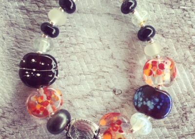 Recycled glass bead bracelet | beads made from gin and tonic water bottles in classic red/black/white colour combination