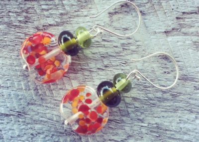Handmade recycled glass bead earrings | red beads made from a tonic water bottle, green beads from wine bottles.