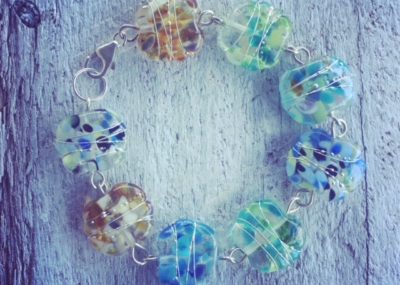 Recycled glass beads | the beads in this bracelet were made from a wine bottle