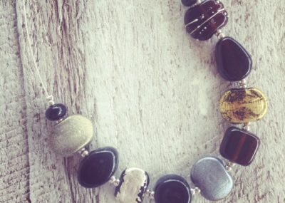 Recycled glass jewellery | silver and gold beads made from gin and beer bottles