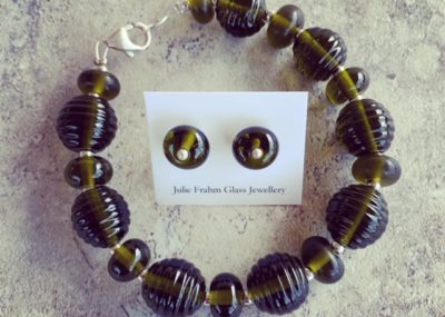 Recycled glass jewellery | beads featured in the bracelet and stud earrings are from a Stones Green Ginger Wine bottle