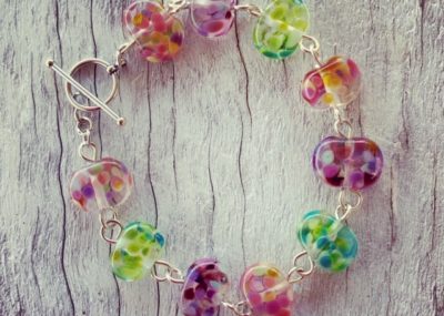 Recycled glass beads | bracelet made from a wine bottle and decorated with pinks and purples and greens