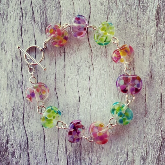 Recycled glass beads | bracelet made from a wine bottle and decorated with pinks and purples and greens