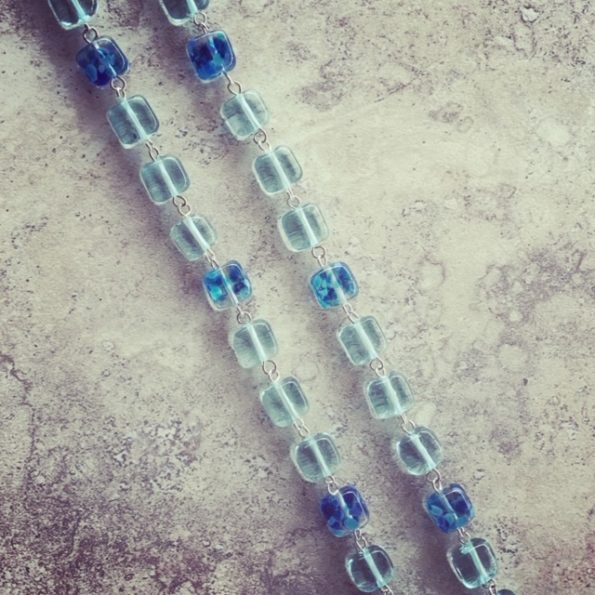 Recycled glass bead necklace, featuring beads made from wine bottles