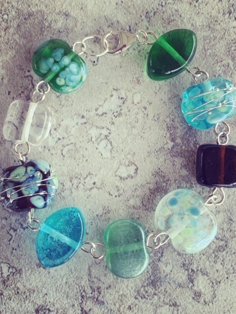 A beautiful glass bracelet, featuring beads made from gin and tonic bottles