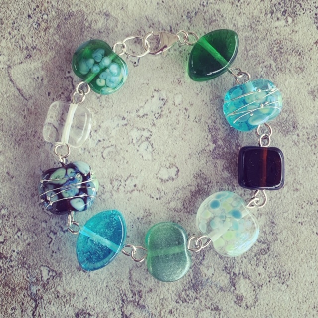 A beautiful glass bracelet, featuring beads made from gin and tonic bottles