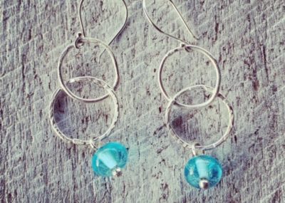 Silver earrings featuring a Bombay Sapphire Gin bottle bead