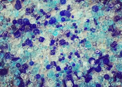 Recycled glass beads made from various blue glass objects