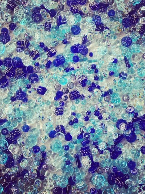 Recycled glass beads made from various blue glass objects