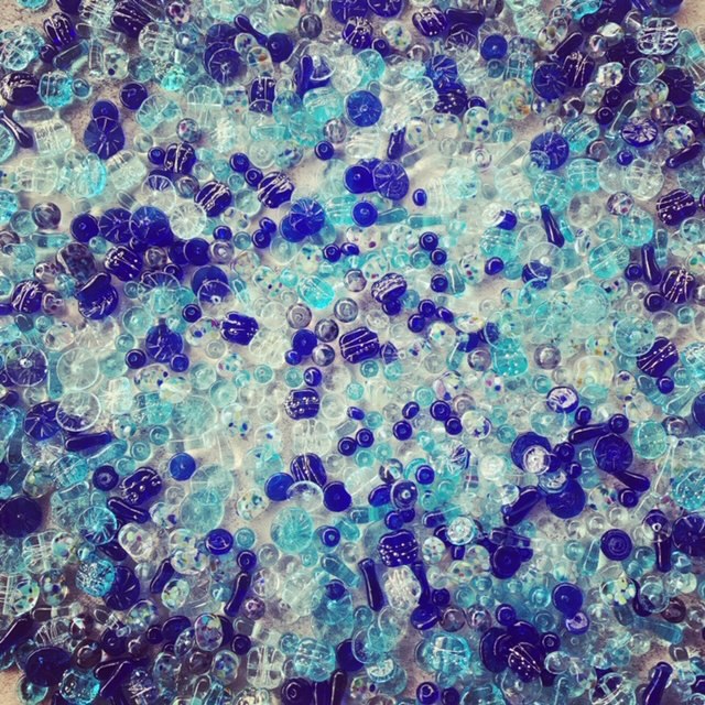 Recycled glass beads made from various blue glass objects