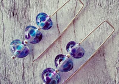 Long dark blue glass earrings made from a wine bottle