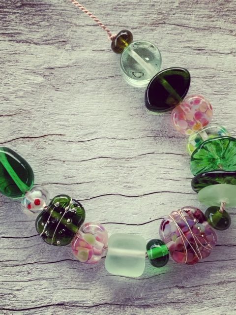 Pink and green recycled glass necklace on silk cord