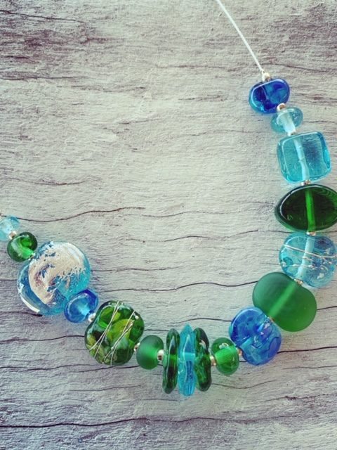 Gin and tonic necklace featuring beads made from Bombay Sapphire and Tanqueray Gin bottles