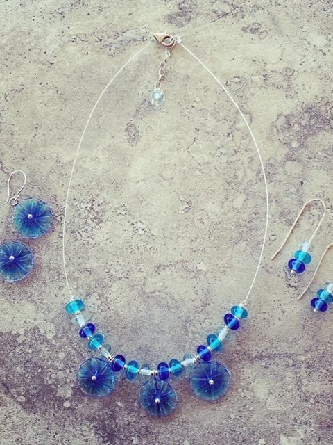 Blue glass flower necklace and matching earrings