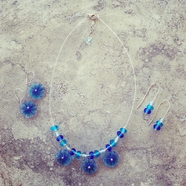 Blue glass flower necklace and matching earrings