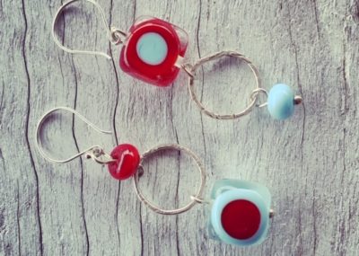 New red and blue mismatched earrings