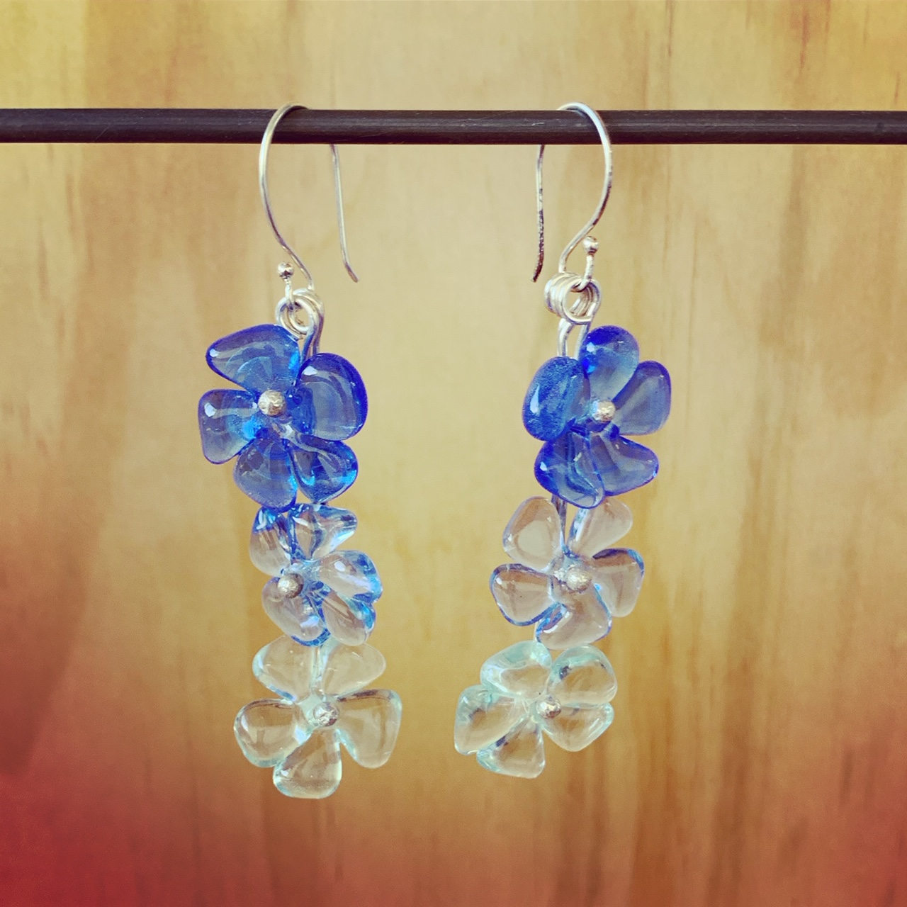 Really long blue glass flower earrings
