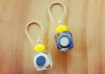 Grey earrings with a pop of yellow
