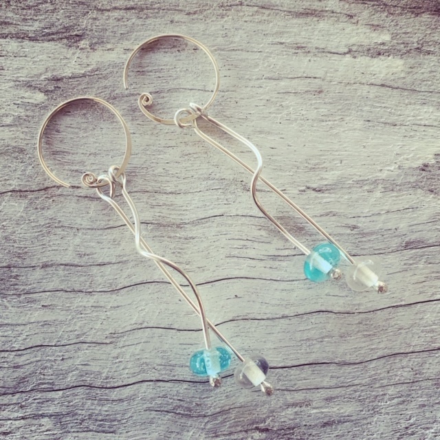 Long, curly Bombay Sapphire Gin earrings