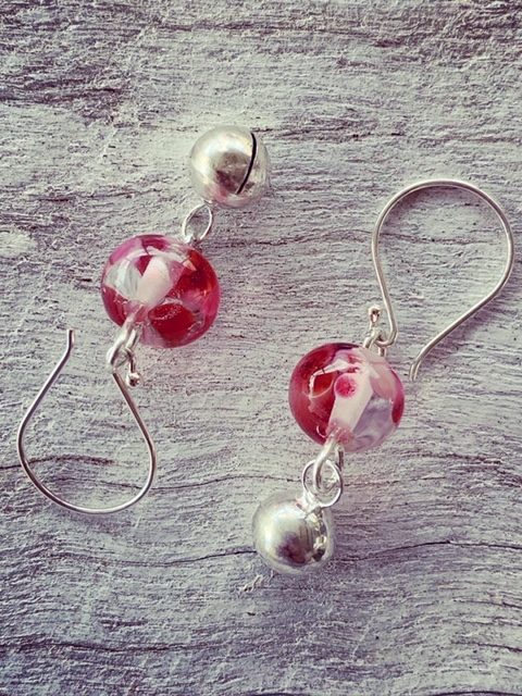 pink recycled glass earrings made from a wine bottle