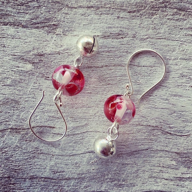 pink recycled glass earrings made from a wine bottle