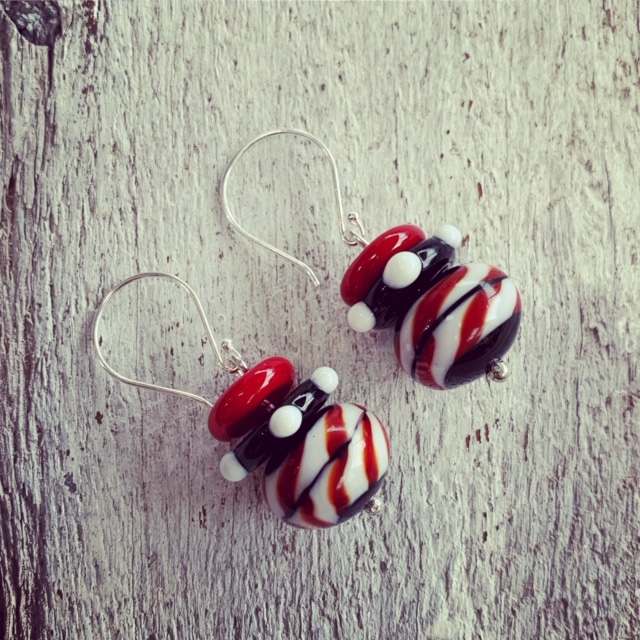 red, black and white earrings