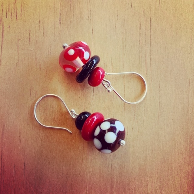Red, black and white mismatched earrings